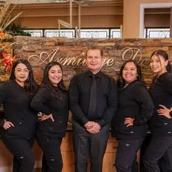 Dr. Abbas Nejad and the Armitage Dental team in their Phoenix office