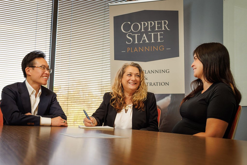 Attorney Leighton Tyau meeting clients at Copper State Planning in Phoenix