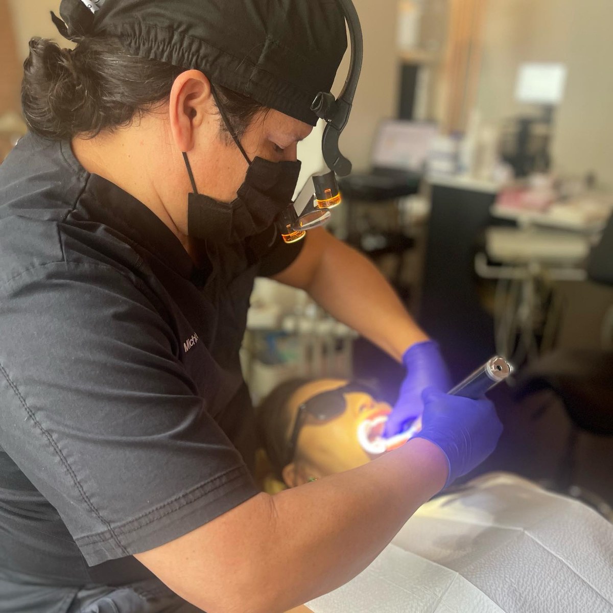 Dr. Michael Wing of Deep Ellum Advanced Dentistry treating a patient at his independent Dallas dental office