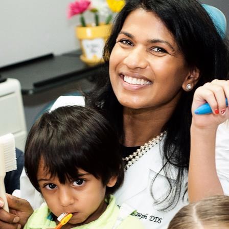 Dr. Elizabeth Joseph of Irving Kids Dentist with a young patient, a pediatric dental office in Irving near Dallas