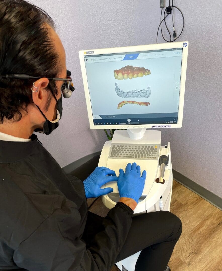 Dr. Jim Kelly reviewing a digital dental scan at his Phoenix office