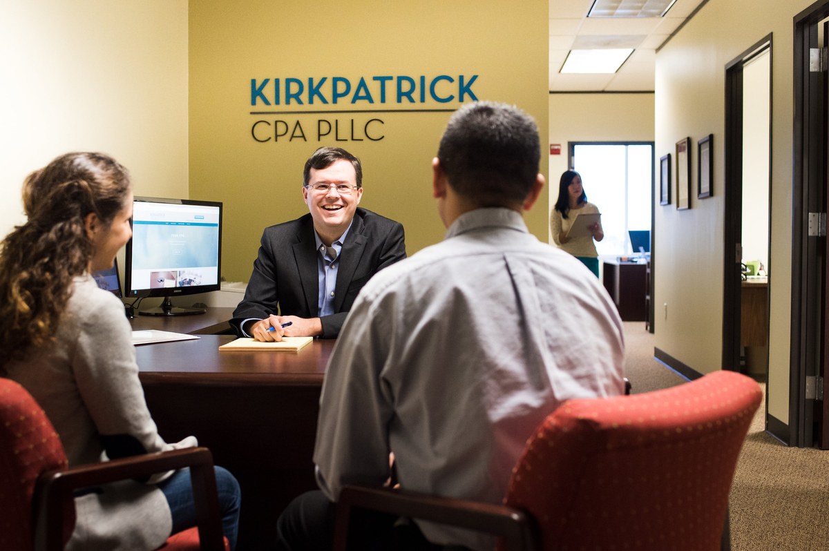 Kirkpatrick CPA PLLC accountant meeting with clients at the firm's Austin office