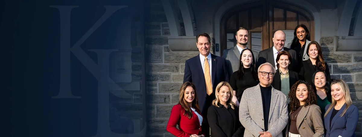 Estate planning attorneys of Klenk Law posed outside their Philadelphia-area office