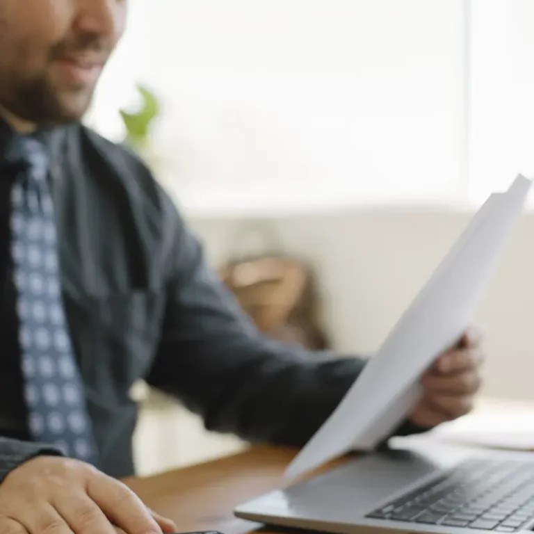 Matthew P. Schlanger, CPA reviewing tax documents