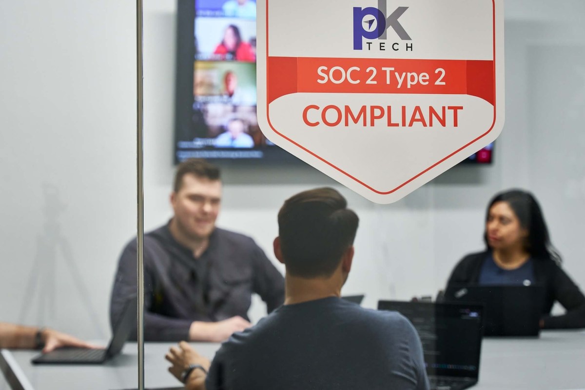 PK Tech team meeting in the Phoenix managed IT office