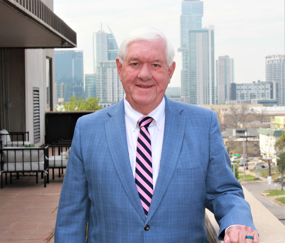 Brad Wiewel, board-certified estate planning attorney and principal of Texas Trust Law, with the Austin skyline behind him