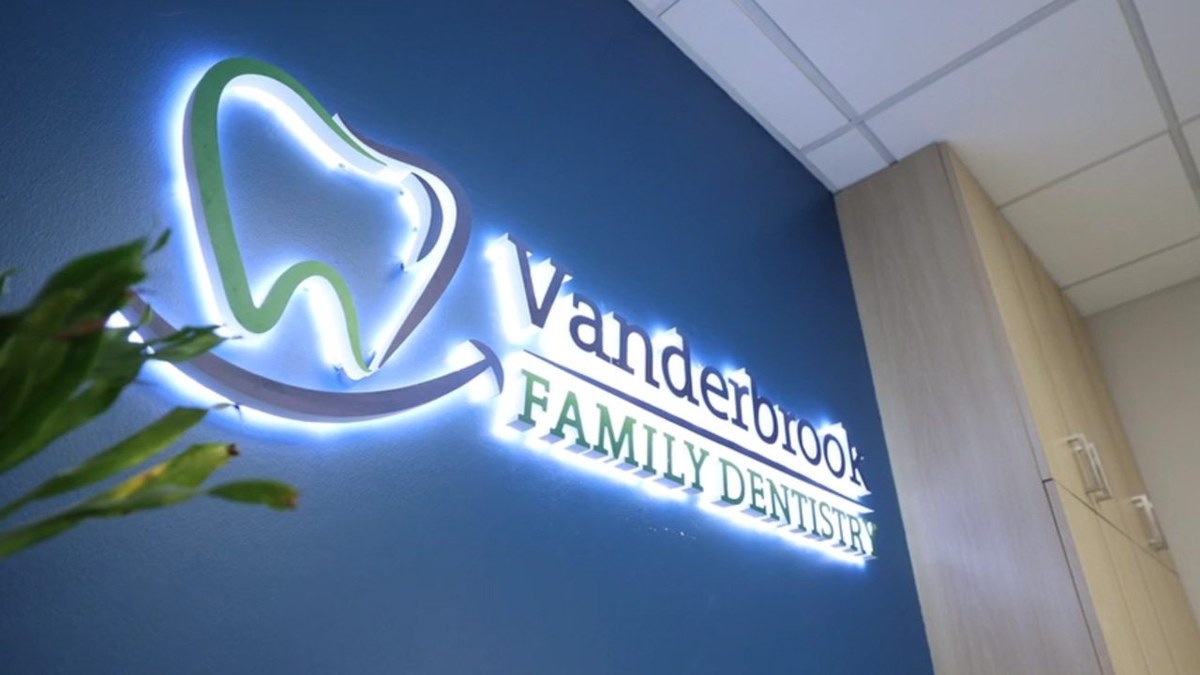 Lit Vanderbrook Family Dentistry sign inside the Dallas dental office